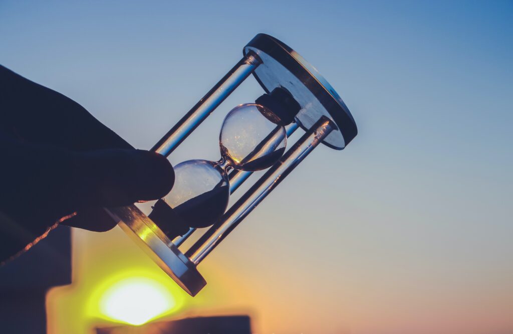 Person Holding Hour Glass 1209999